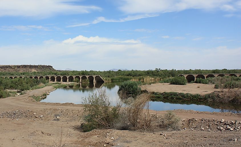 Gillespie dam near Buckeye, Arizona, with the Gila River flowing through the breach