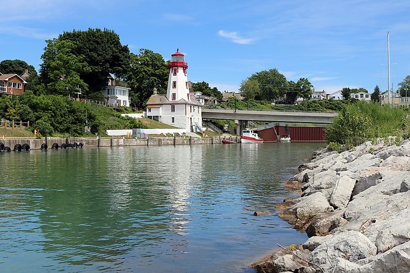 Editorial Photo Credit: Diane Kuhl via Shutterstock. Kincardine, Ontario Lighthouse reflects in pristine inlet of Lake Huron