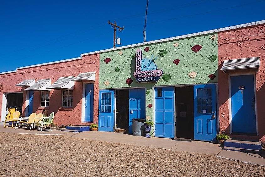 Tucumcari, New Mexico - September 6, 2020: Sunlight at the laundry room and neon signs at the historic Blue Swallow Motel on Route 66.