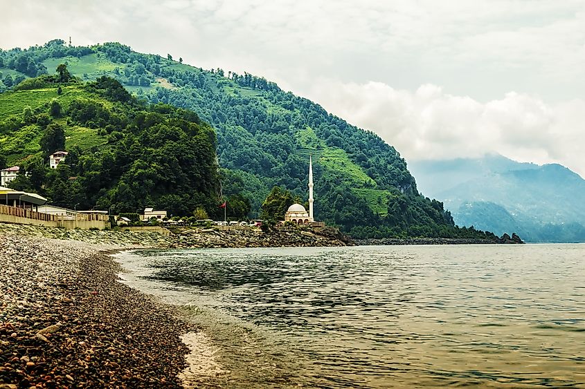 Turkish Mosque on Border crossing between Georgia and Turkey (Sarp),view from Georgian Sarpi beach sea with mountains.