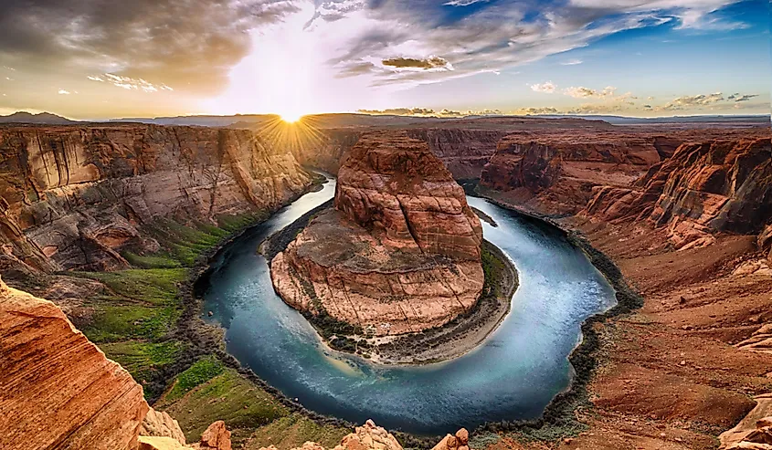 The Colorado River winding through the layered cliffs of the Grand Canyon.