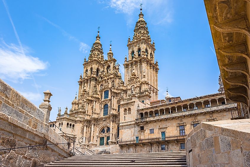 A stone staircase leads to the impressive facade of the Santiago de Compostela Cathedral