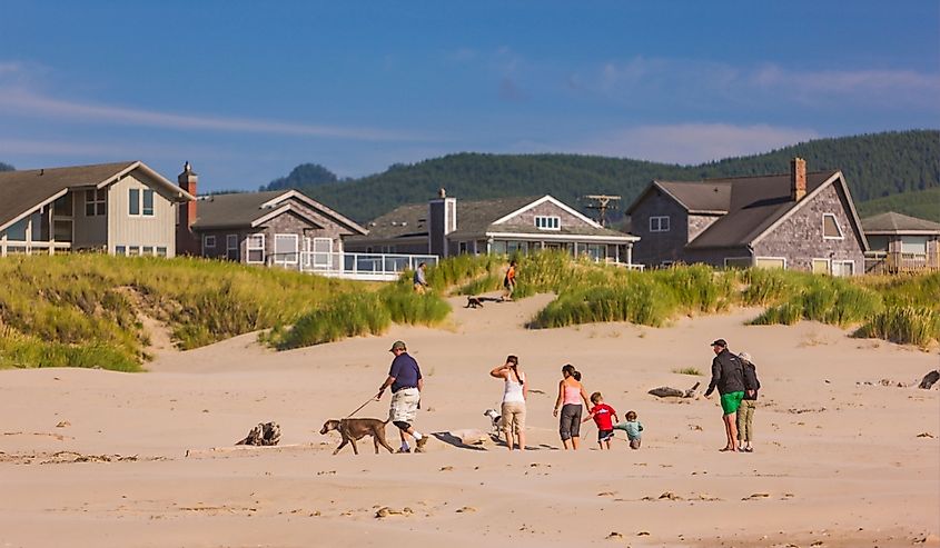 People on beach on Oregon coast in Manzanita, Oregon.