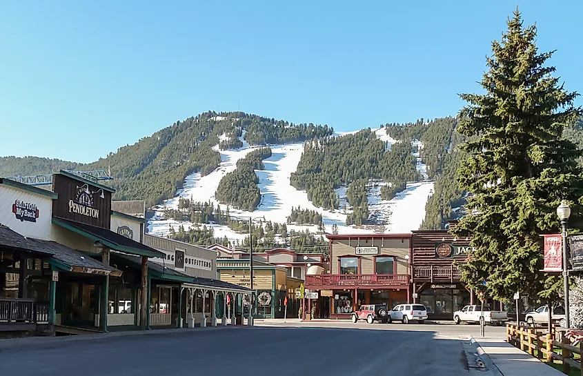 Ski slopes in Jackson Hole with panorama of vintage houses.