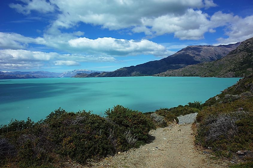 Nature of Patagonia, Glacial lake O'Higgins or San Martin, Rocky road from the border between Chile and Argentina to Candelario Mancilla. Via Shutterstock / art of line.
