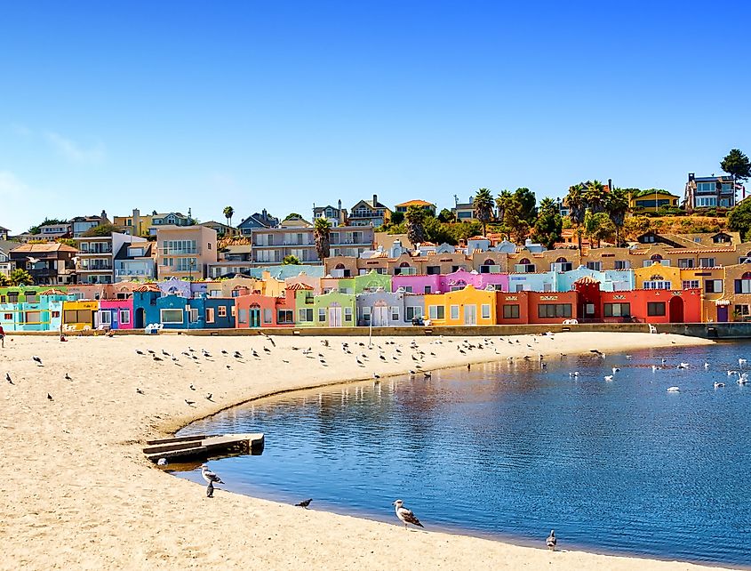Pastel-colored Venetian Court homes above the beach in Capitola, California