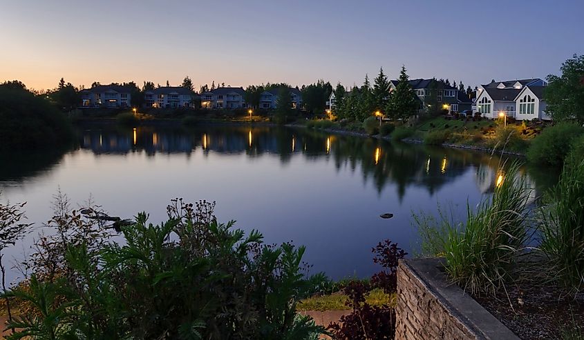 Calm water of the private Staats lake in dusk, Keizer, Oregon. Image credit Victoria Ditkovsky via Shutterstock