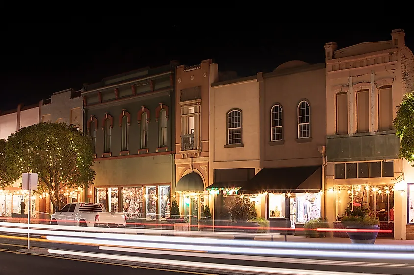 Night time traffic streams through historic downtown Red Bluff, California, USA.