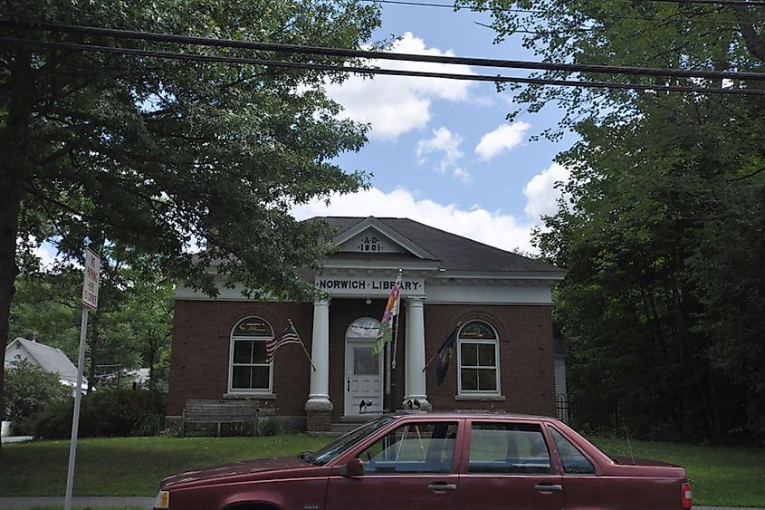 Red car in front of the Norwich Public Library, Vermont.