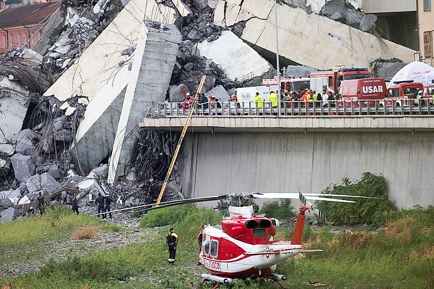 Rescuers work to recover injured persons after a large section of the Morandi highway bridge collapsed in Genoa.