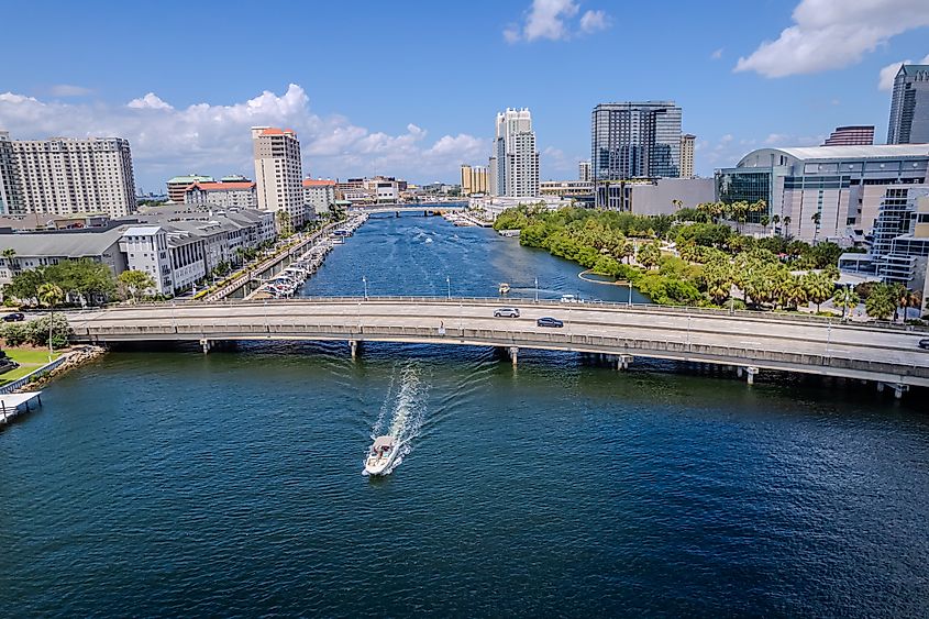 Aerial view of downtown Tampa, Florida, with a bridge crossing the Hillsborough River.