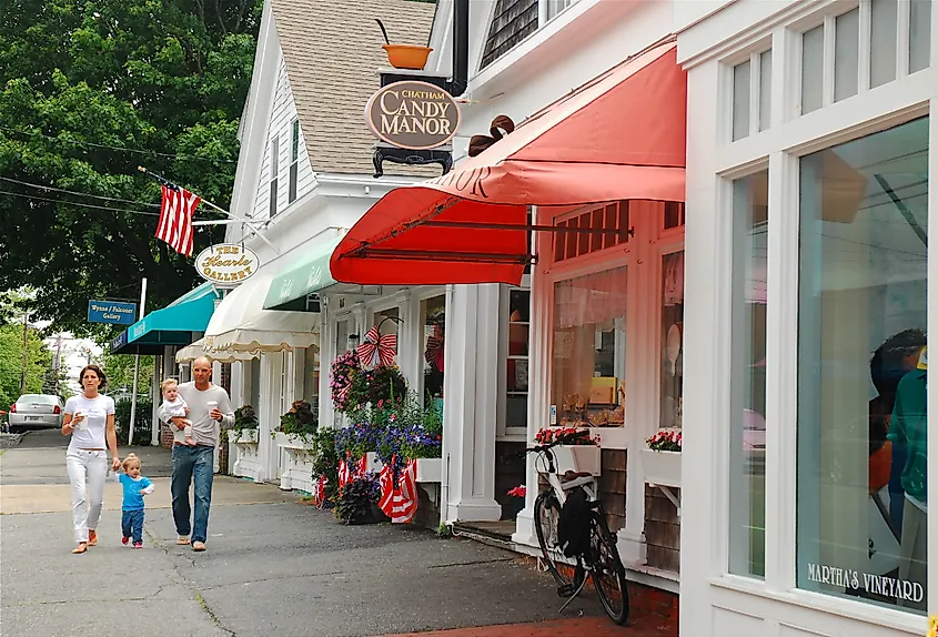 A young family walks through the Cape Cod town of Chatham, Massachusetts.