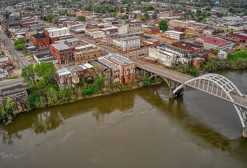 Overlooking Selma, Alabama, showcasing the town's historic architecture, streets, and the iconic bridge spanning over the river.