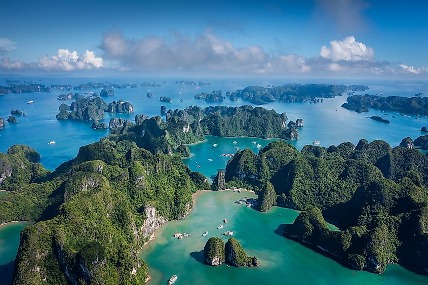 Aerial view of Ha Long Bay in beautiful sunny day, emerald green water.