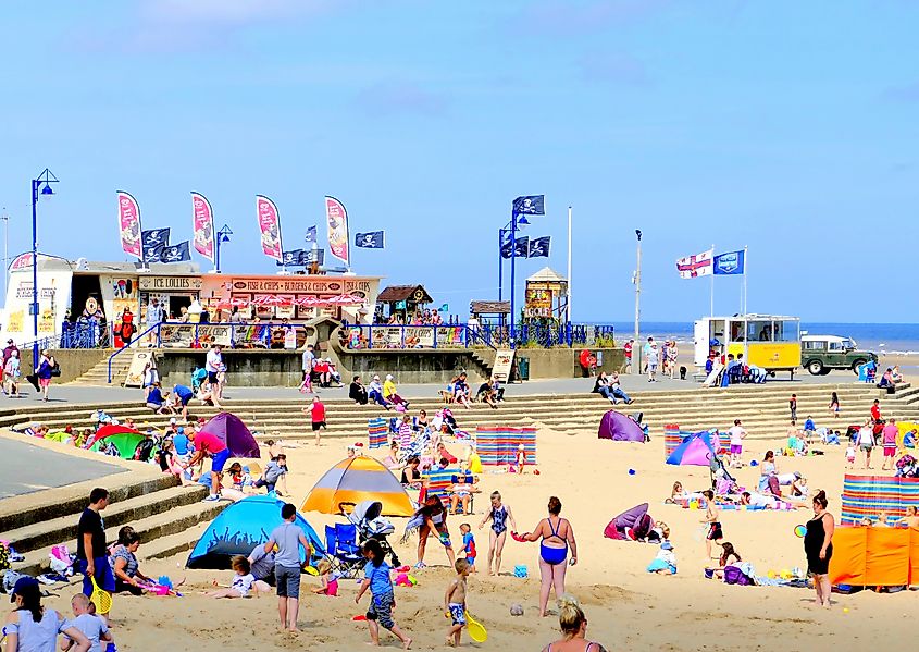 Holidaymakers enjoying the sunshine on the busy beach at Mablethorpe, Lincolnshire.