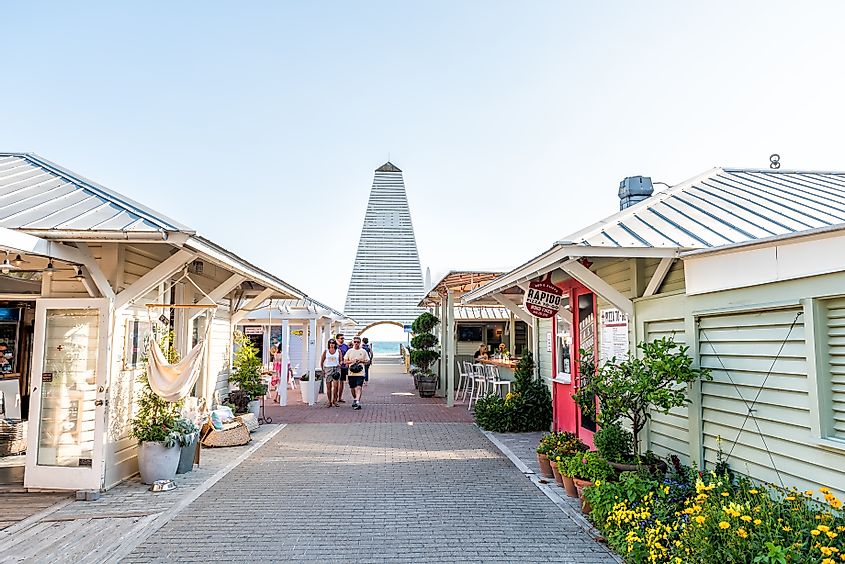 Seaside, USA - April 25, 2018: Shopping mall park square center in historic city town beach village during sunny day in Florida panhandle, white architecture, people, Obe pavilion tower