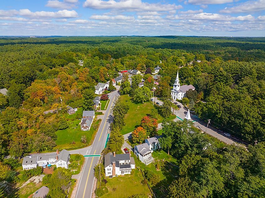 Carlisle historic town center aerial view including First Religious Society church at 27 School Street and Town Common in historic town center of Carlisle, Massachusetts MA, USA. 