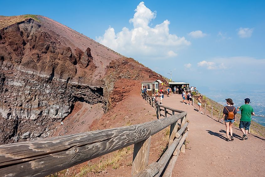 Tourists walk around the crater of Mount Vesuvius.
