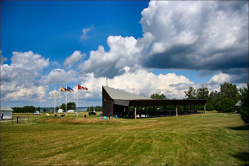 A building along the coast of Lac Sainte Anne in Canada.