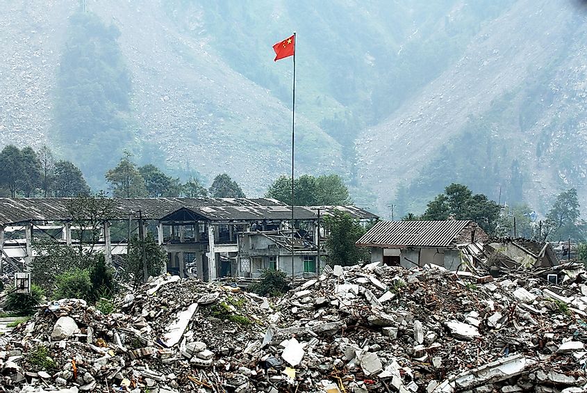 Chinese national flag on earthquake ruins