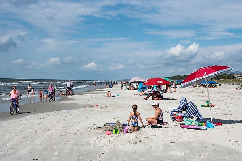 A photo of beach-goers with umbrellas at Coligny Beach Park, Hilton Head Island, South Carolina