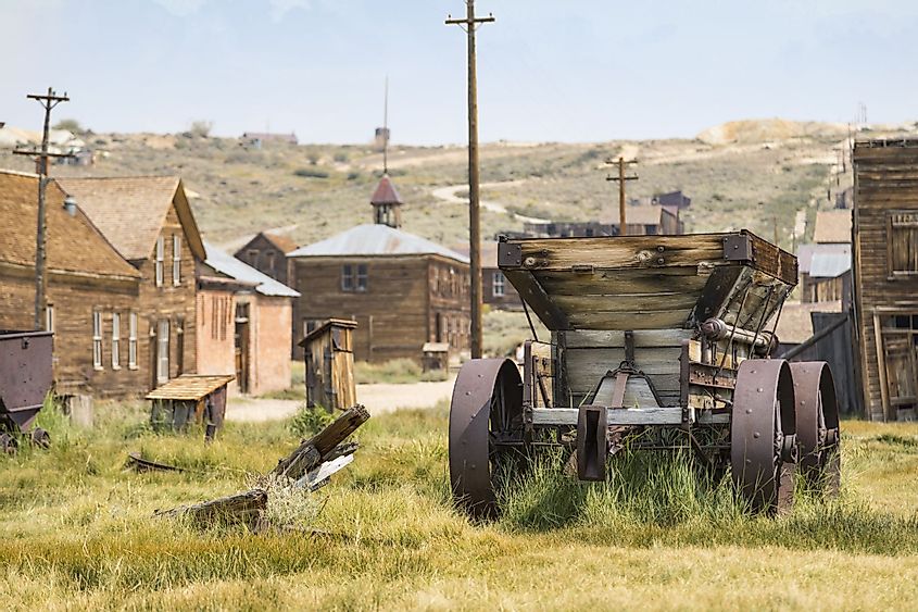 Old buildings and a cart in Bodie ghost town, California
