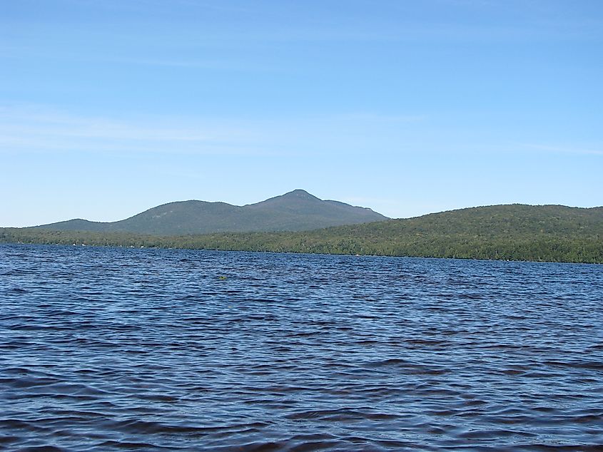 Meacham Lake, New York with DeBar Mountain is on the horizon.