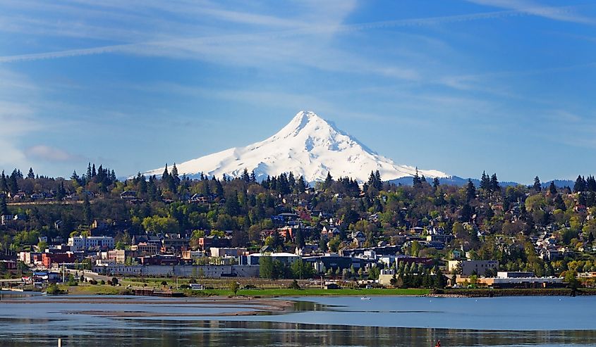 Snowcapped Mount Hood with homes at the base.