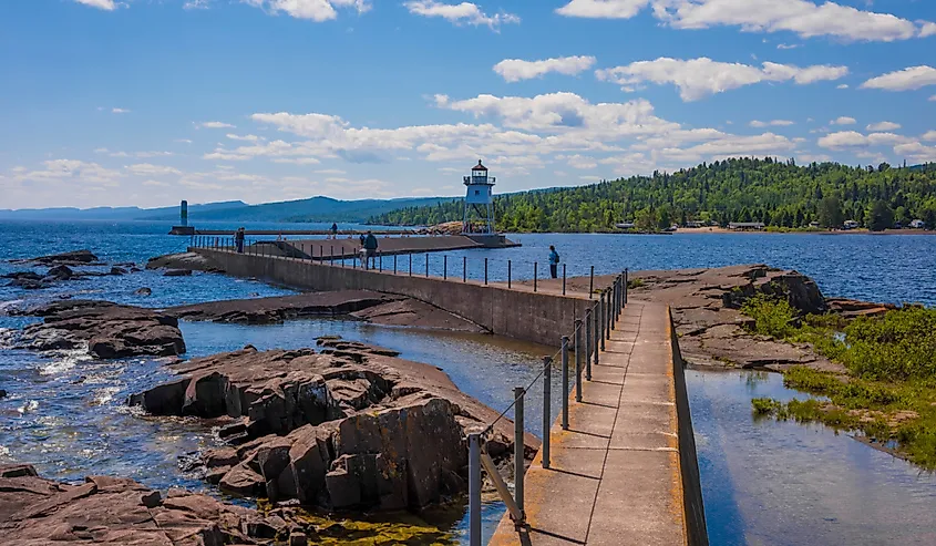 Grand Marais Light against the backdrop of the Sawtooth Mountains on Lake Superior. Grand Marais, Minnesota.