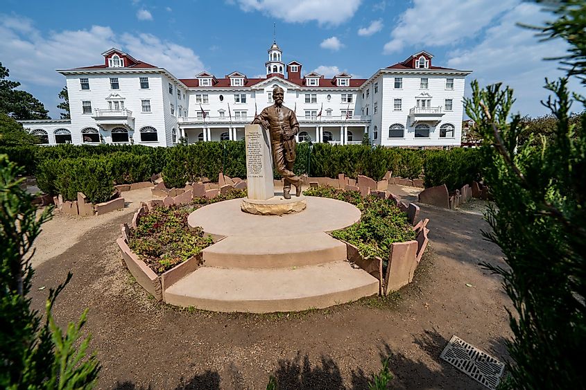 Exterior of the Stanley Hotel with the statue of F. O. Stanley in the foreground. 