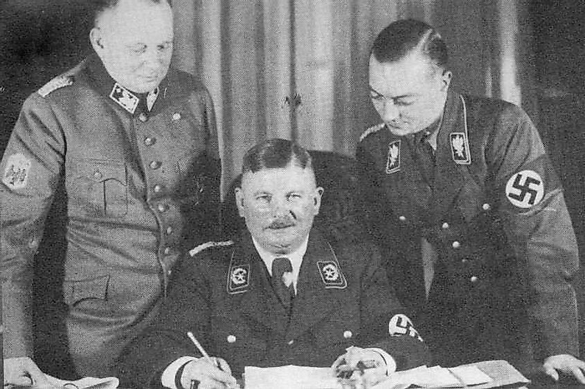 Ernst Roehm (centre) shortly after his appointment to the office of Minister without Portfolio in the Hitler Government in December 1933.