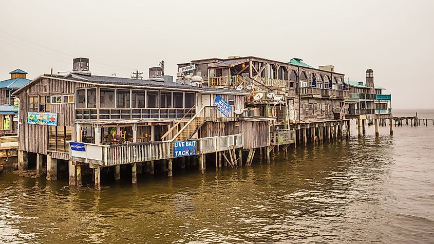 Waterfront buildings on stilts in the historic downtown of Cedar Key, Florida