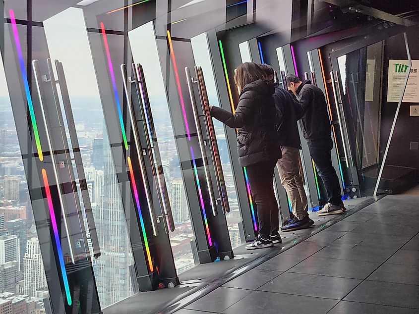 people on the Tilt at the 360 Chicago Observation Deck, John Hancock Center, 875 North Michigan Avenue