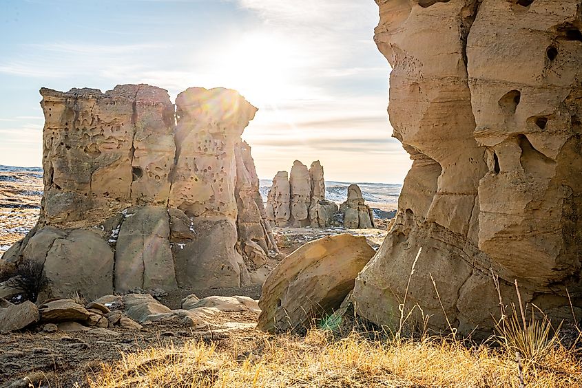 A beautiful view of rocks with a sea in the background in Medicine Rocks State Park.