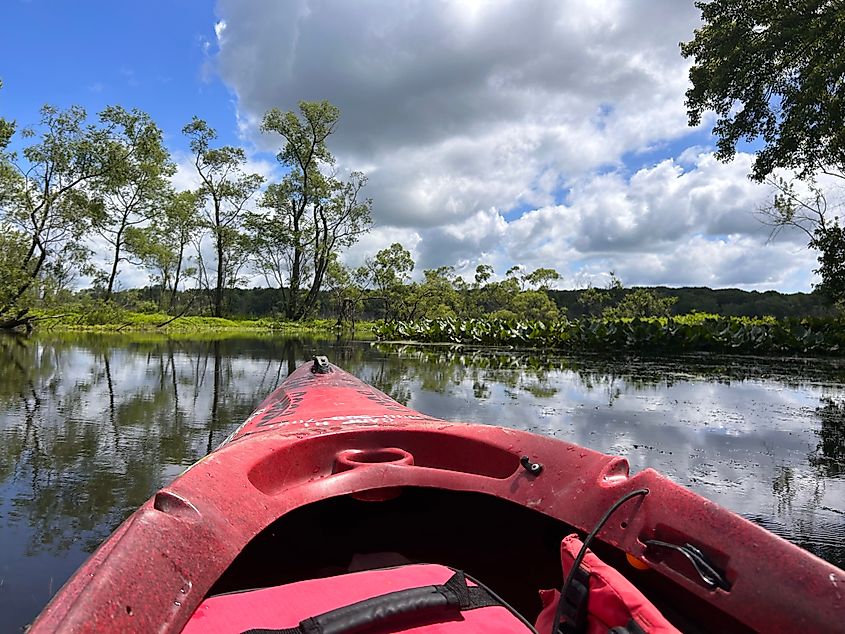 A red kayak floats down the Cuyahoga River in Ohio