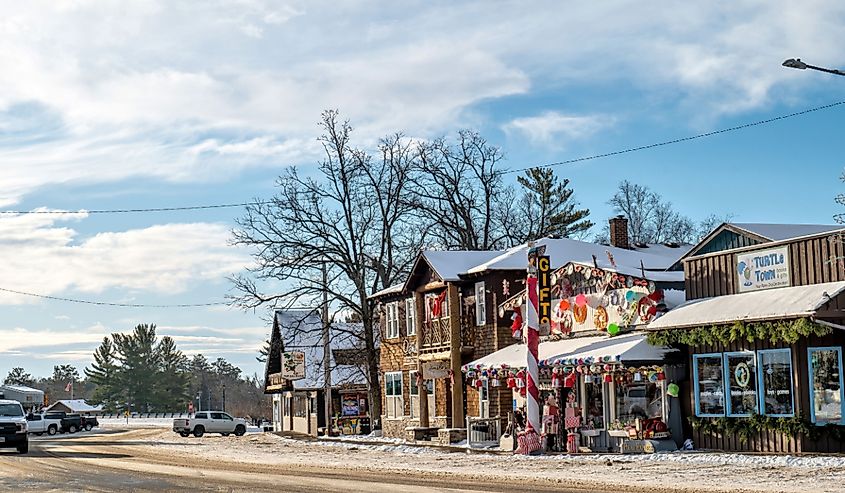 Main street in winter with stores decorated for Christmas holiday in winter in Minnesota.