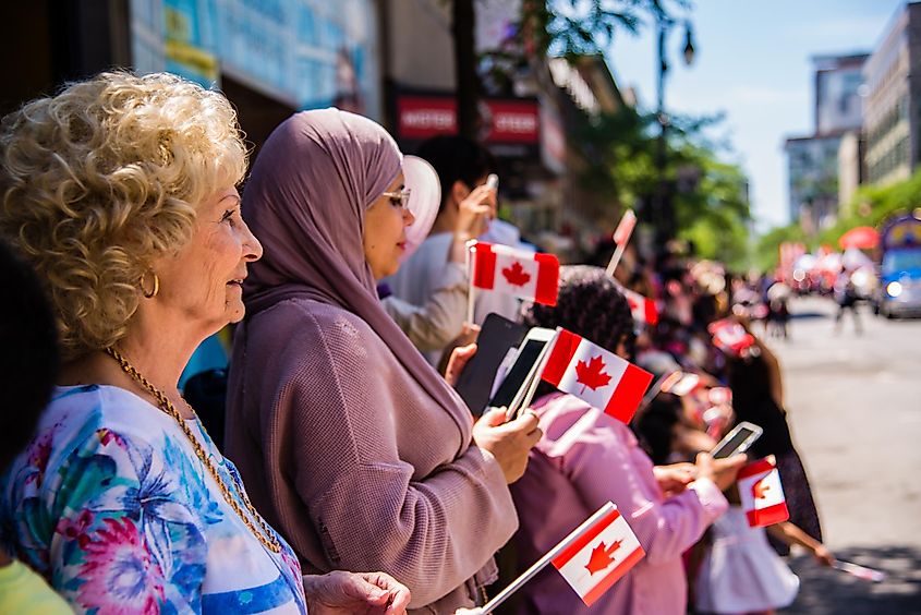 People gathering at downtown Montreal watching the Canada Day Parade