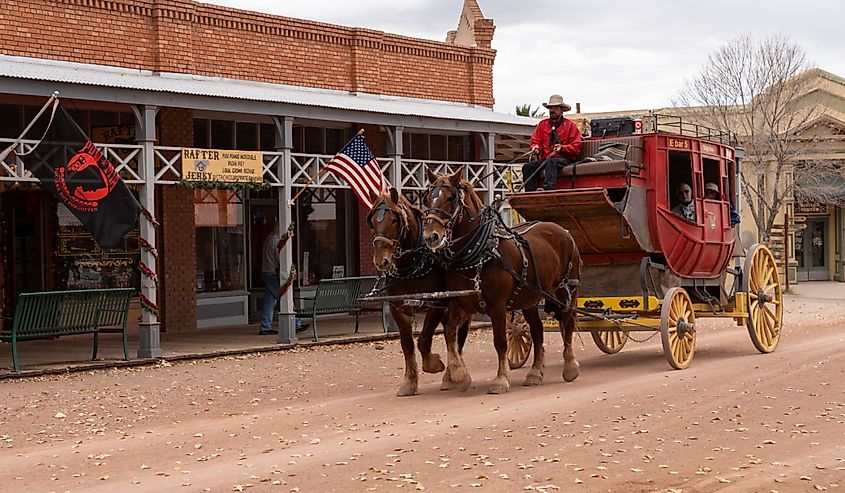 Horse drawn carriage with tourists travels down historic Allen Street