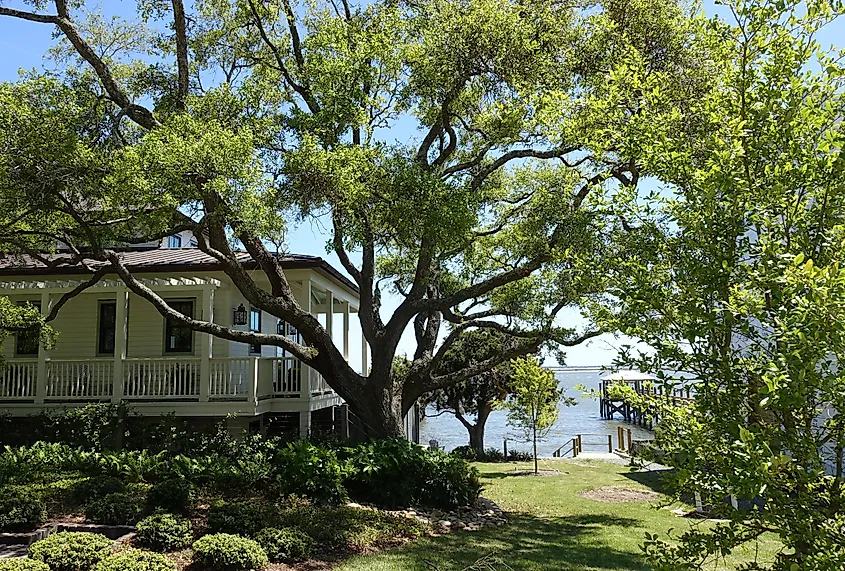 A peak of the ocean between homes in a Southport, North Carolina neighborhood.