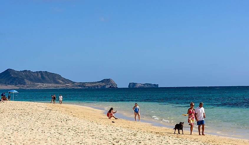 People walking along Lanikai Beach, Kailua, Oahu, Hawaii
