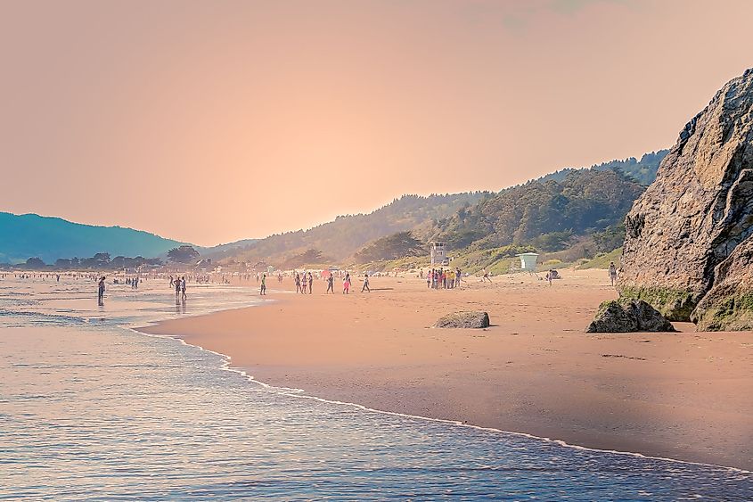 People swimming and walking in Stinson Beach near San Francisco, California