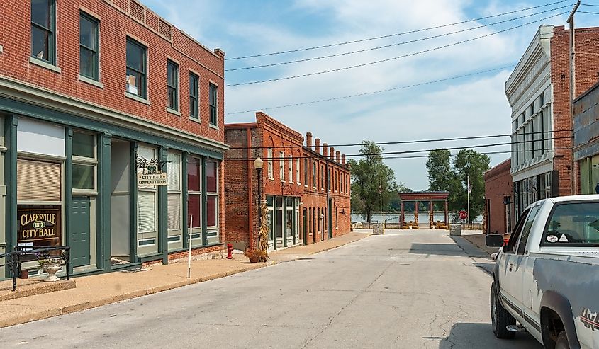 Mainstreet in small town America lined with typical red brick buildings leading to Mississippi River, Clarksville