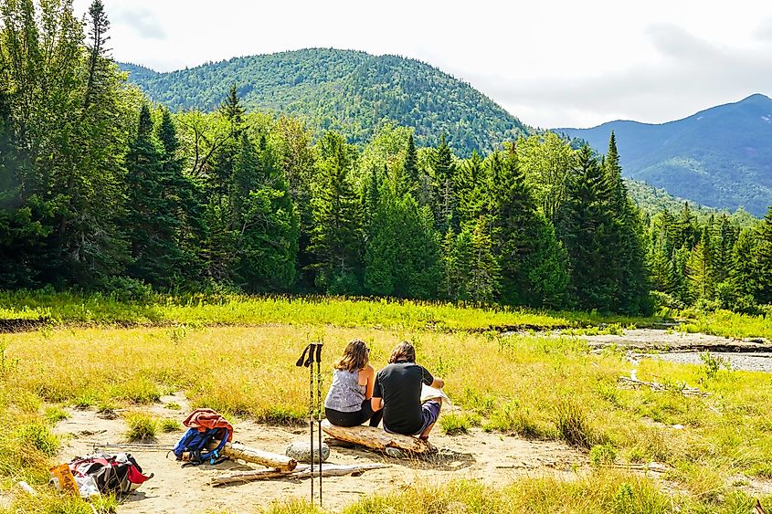 Tourists at the Avalanche Lake Trial in the High Peaks Wilderness Area near Keene, New York.