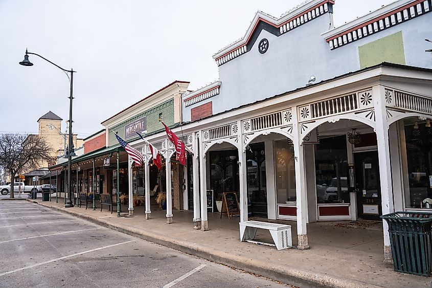 Street scene from hill country town, Fredericksburg, Texas, with historic buildings in view.