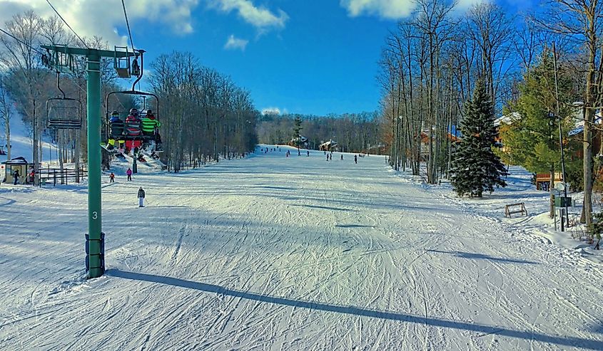 Skiers on the Boyneland Lift at Boyne Mountain in Northern Michigan.