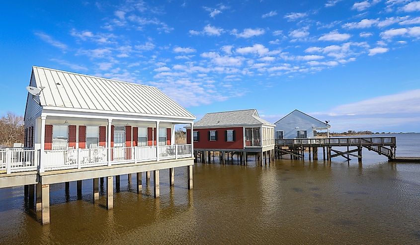 Rental cabins perched over Lake Pontchartrain inside Fontainebleau State Park.