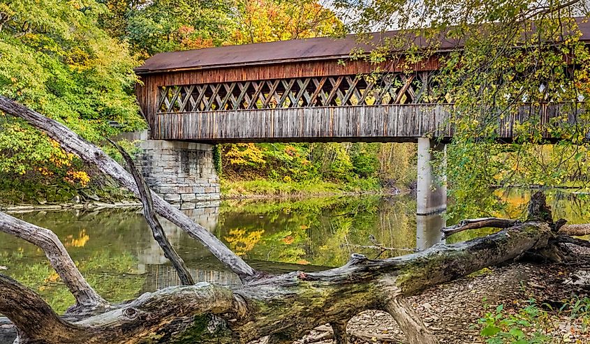 State Road Covered Bridge, built in 1983, crosses Conneaut Creek in rural Ashtabula County, Ohio in autumn.