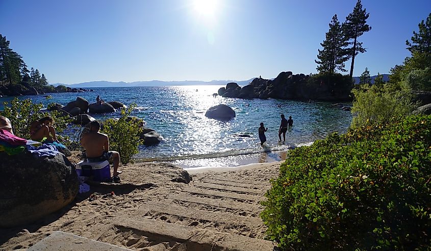 People enjoying the end of summer at the beach. Photo taken at Sand Harbor State Park in Lake Tahoe over the Labor Day weekend.
