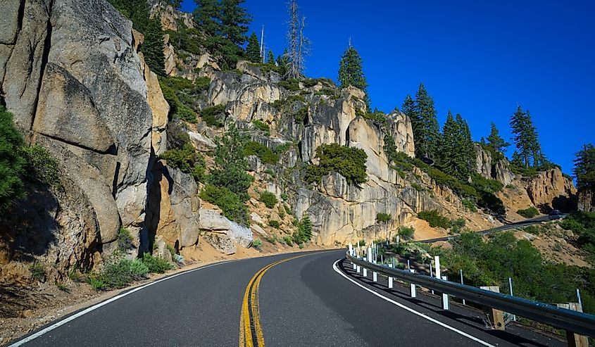 Curving Sonora Pass road with rocky edge