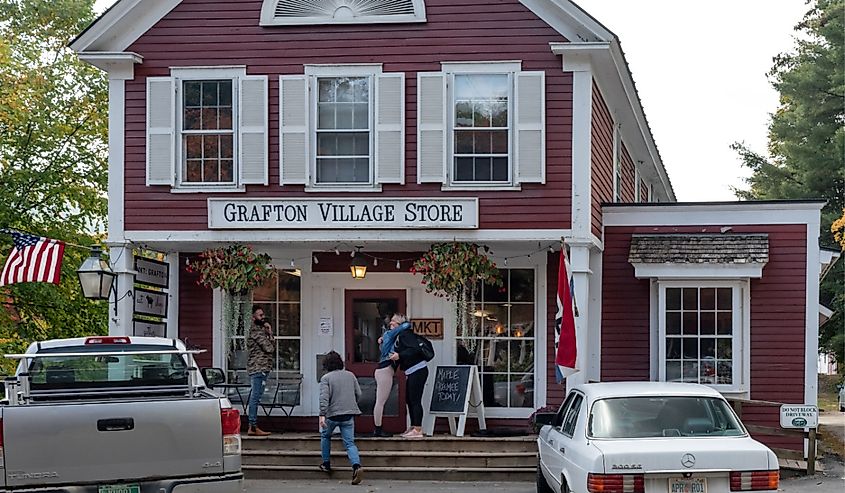 People standing outside Grafton Village Store, Vermont.